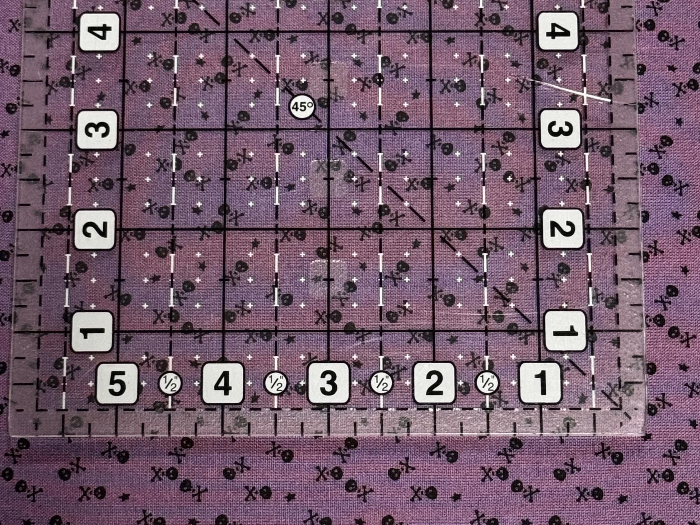 Beggar's Night Skulls in Purple - 1/2 Yard Increments, Cut Continuously - by Sandy Gervais for Riley Blake Designs