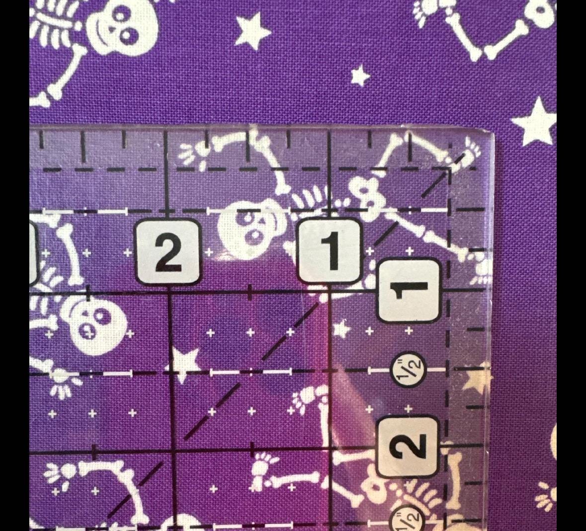 Glow-O-Ween Glow in the Dark Purple Glowing Skeletons - 1/2 Yard Increments, Cut Continuously - by Kanvas Collection for Bernatex Fabrics