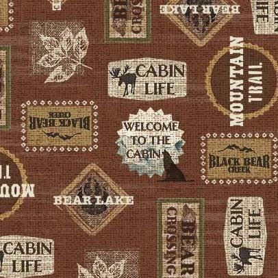 Welcome to the Cabin Trail Signs in Rust - 1/2 Yard Increments, Cut Continuously - by Michael Miller
